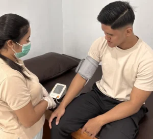 Patient receiving health check before IV Drip Treatments at Nawadipa Medical Care in Tabanan Bali