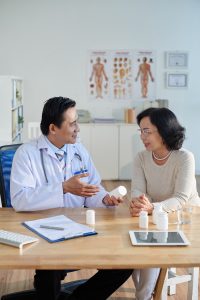 Trusted Clinics in Tabanan – Doctor consulting patient and explaining prescription
