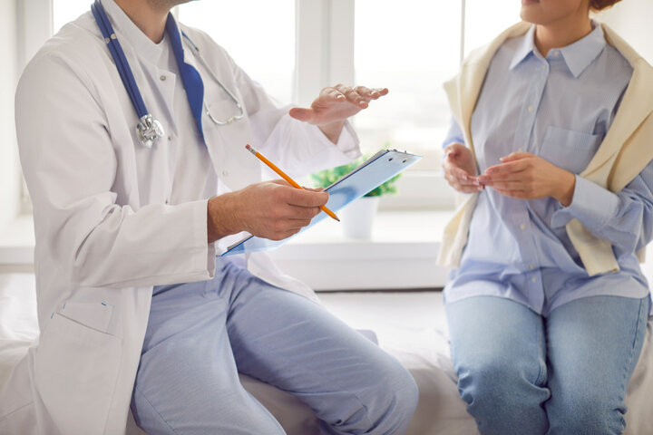 Doctor explaining results during a Health Check Up as part of General Health Checkups service.