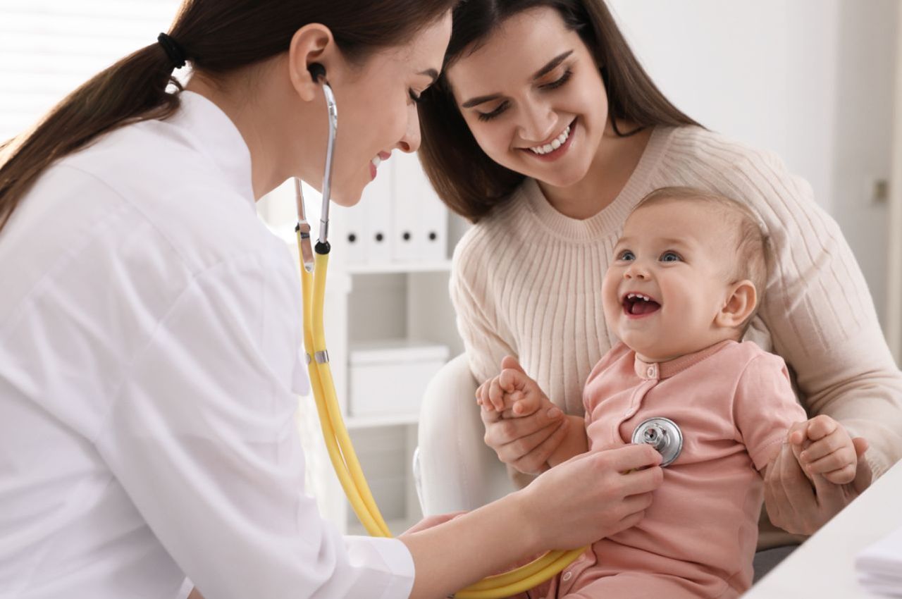 Pediatric nurse and mother supporting child during medical care, demonstrating professional Child Health Services in Bali.