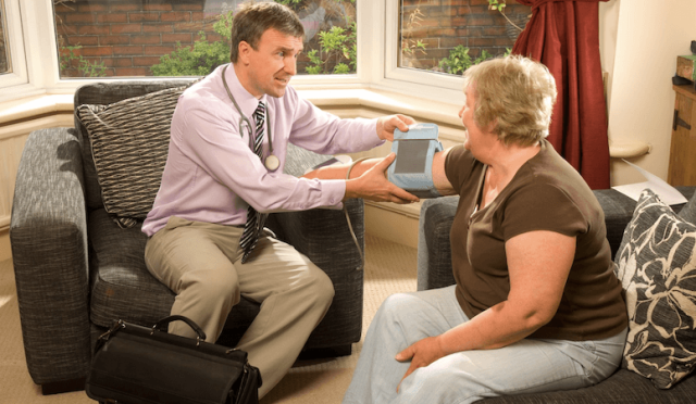 Home visit healthcare service for senior patient receiving care in Ubud villa resort.