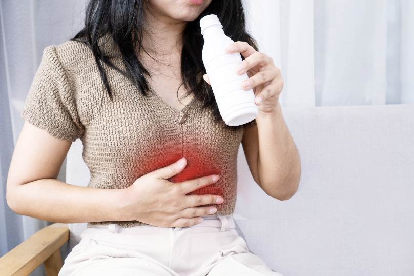 tourist holding stomach medicine after being treated by emergency doctor Bali for Bali belly